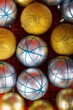 Colored Christmas balls on a red background