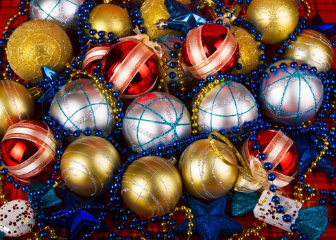 Colored Christmas balls on a red background