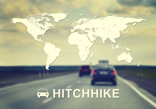 Contoured map of world continents with inscription Hitchhike and related symbol. Blurred panorama of highway as backdrop.