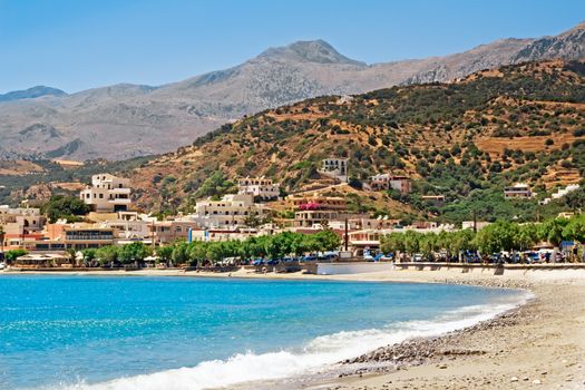 Landscape with sea view, sandy beach, a resort town, the mountains.. the South coast of Crete, Greece.