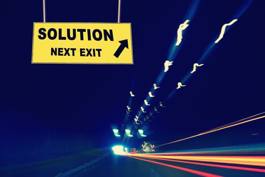 A Notice Board On A National Highway tunnel  Showing Solution Next Exit Concept