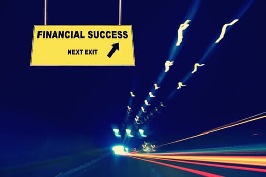 A Notice Board On A National Highway tunnel  Showing Financial Success Concept