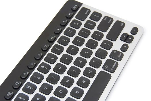 Modern aluminum computer keyboard isolated on white background