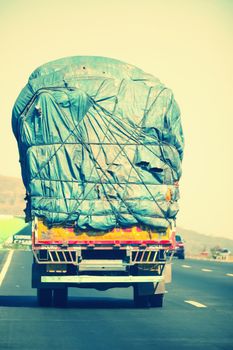 Overloaded indian lorry driving on the national highway 4