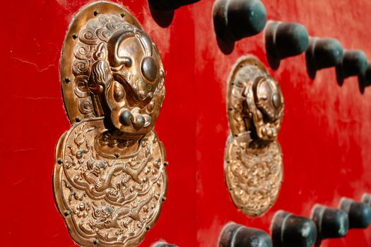 Chinese traditional  red door  in forbidden city, Beijing, China.