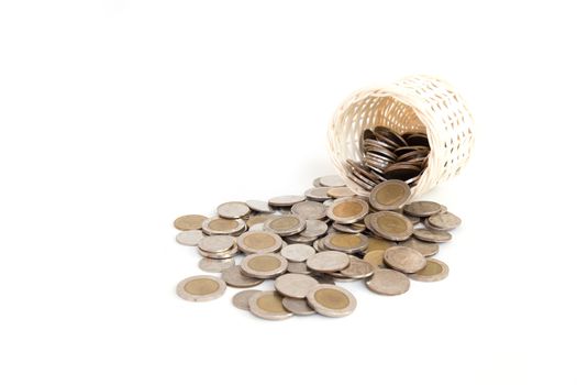 Wooden Basket handmade and stack of coin isolated on white background