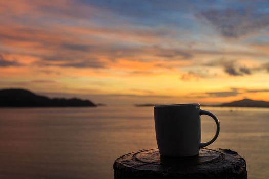 Coffee cup and sunset