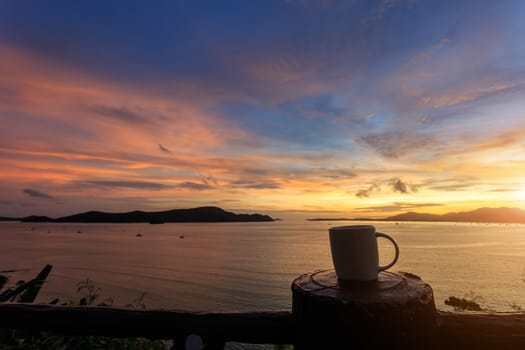 Coffee cup and sunset
