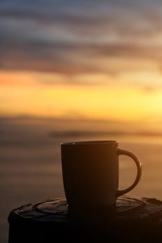 Coffee cup and sunset