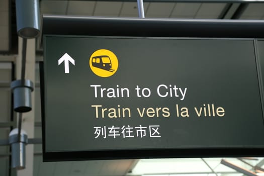 Train to city sign at airport