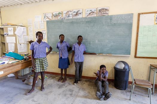 NAMIBIA, KAVANGO, OCTOBER 15: Happy Namibian school children waiting for a lesson. Kavango was the region with the highest poverty level in Namibia, more than 50% of the population were classified as poor. October 15, 2014, Namibia