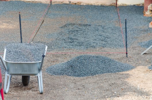 Preparation and production garages driveway with paving stones.