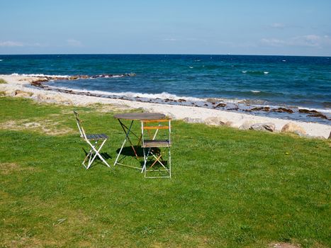 Chairs and table relaxing seating corner on a beautiful beach 