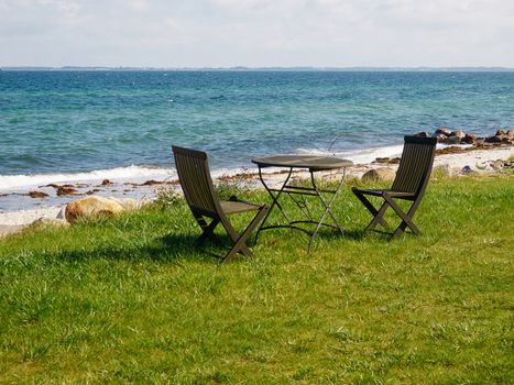 Chairs and table relaxing seating corner on a beautiful beach