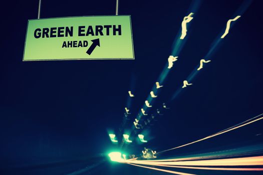 A Notice Board On A National Highway tunnel  Showing Green earth Ahead Concept