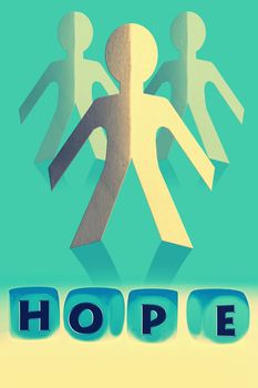 word Hope on cubes in front of paper man