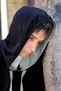 Sad Teenager Portrait by the Old Wall