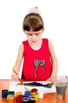 Concentrated Little Girl Drawing Isolated on the white background