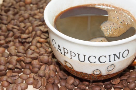 Coffee cup with coffee beans.