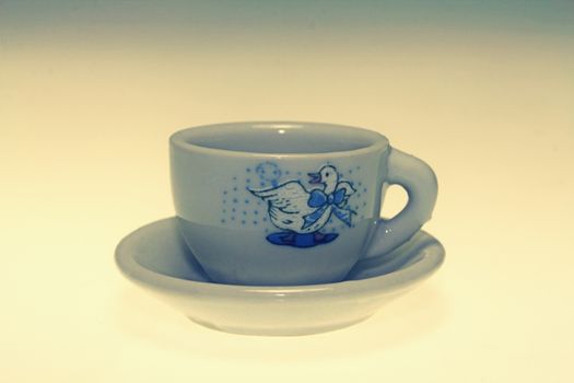 Toy teacup with saucer