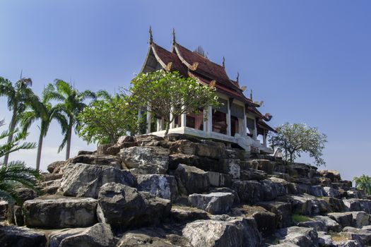 Pavilion on Boulders with Flowering Trees. Chon Buri, Thailand