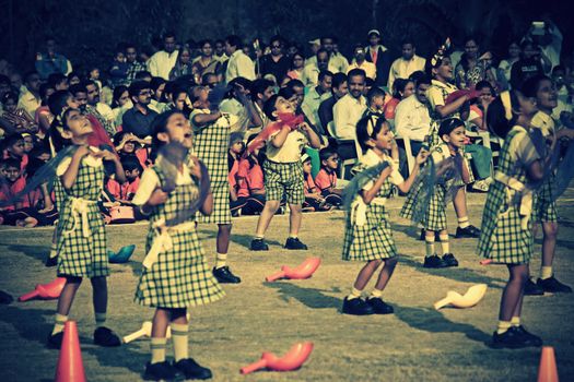 Children dancing with a theme on School Playground