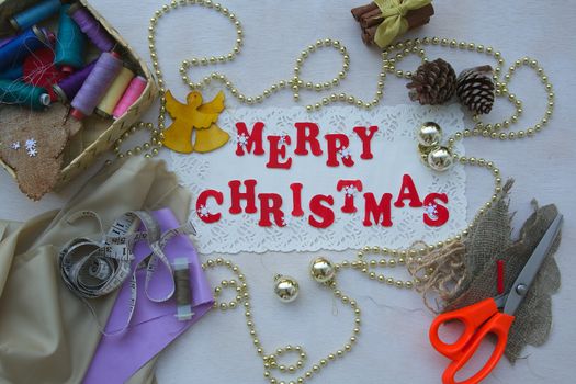 Christmas background for seamstresses with inscription "Merry Christmas"