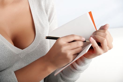 Horizontal shot of a personal assistant taking meeting minutes