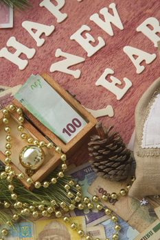 Money present in a small wooden box on a festive background