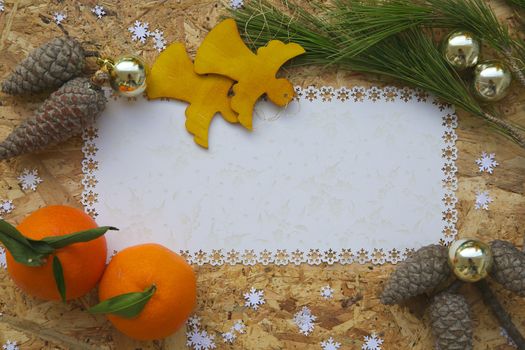 Winter holidays background on a wooden surface. Free space for a text