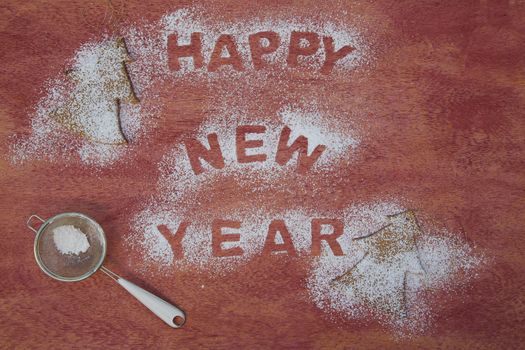 New Year's Day background with sugar trace inscription: "Happy New Year"