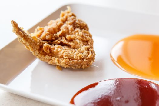 Fried chicken with chili sauce and tomato sauce