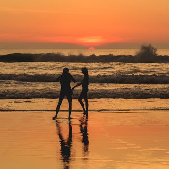 Silhouette of tourist at sunset beach in Phuket Thailand