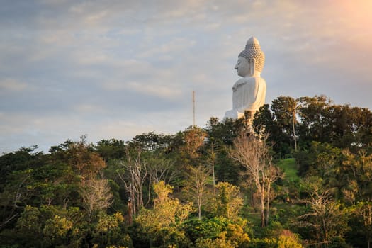 Big white buddha statue on mountain in Phuket