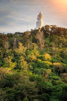 Big white buddha statue on mountain in Phuket