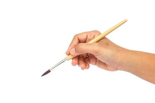 Hand holding paintbrush isolated on white background