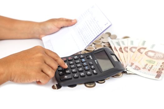 Hand pressing calculator and holding book bank  isolated on white background