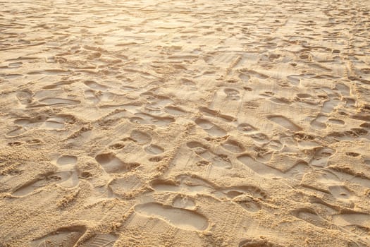 Texture of sand and footprints in the sand