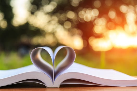 Close up book on table in sunset time