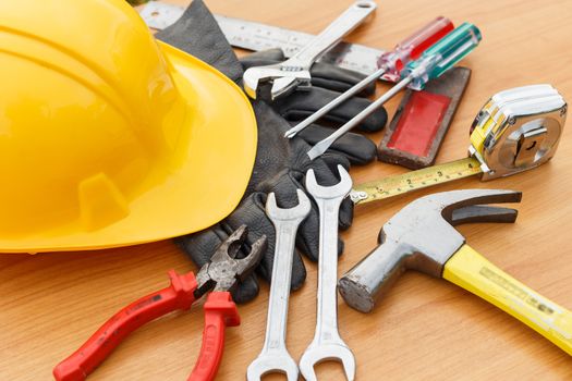 Closeup of assorted work tools on wood