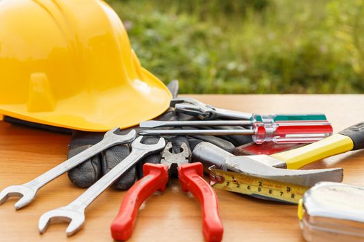 Closeup of assorted work tools on wood