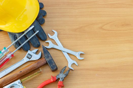 Closeup of assorted work tools on wood