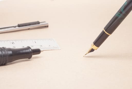 Vintage Fountain Pen on old paper background