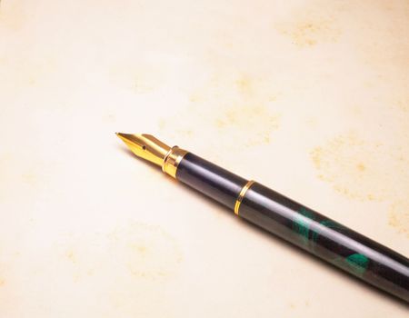 Vintage Fountain Pen on old book background