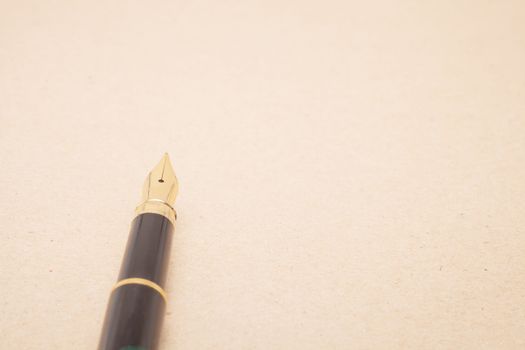 Vintage Fountain Pen on old paper background