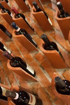 Fine red wines rest in their pits at Italian winery