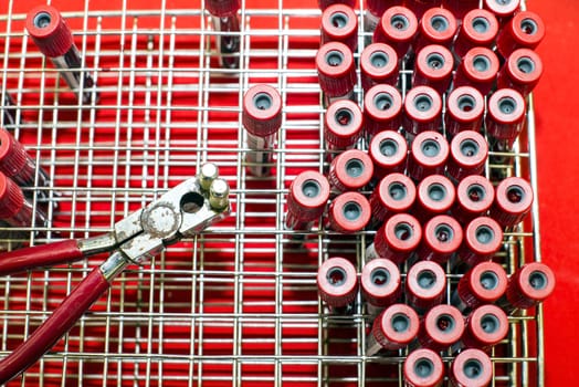 Rack of tubes with blood samples, laboratory microscope and laboratory