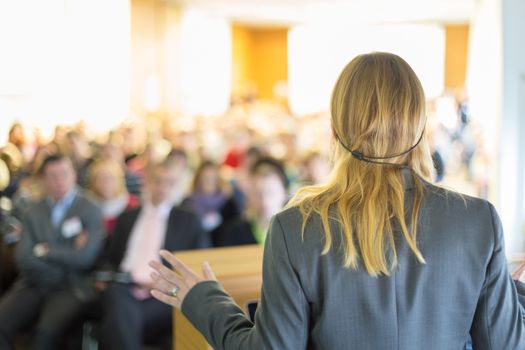 Female speaker at Business Conference and Presentation. Audience at the conference hall. Business and Entrepreneurship. Business woman.