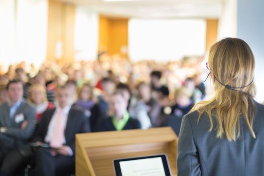 Female speaker at Business Conference and Presentation. Audience at the conference hall. Business and Entrepreneurship. Business woman.