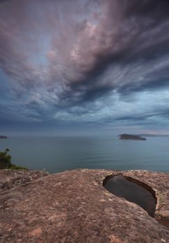 Dusk skies over Pearl Beach Broken Bay colours of saphire, topaz, aquamarine and rose quartz and shades of teal and jade in the ocean seas with majestic views to Lion Island and Pittwater from Mt Ettalong. Colours of blue, aqua, pink and jade dominate the scene.